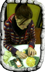 Helen working on her second artwork applying mosaic onto a 3 dimensional shape, a half sphere she casted using plaster as a base