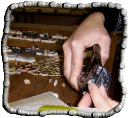 Close up of Jess cutting a tiny piece of tile